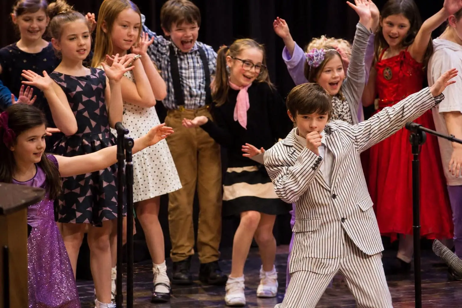 Children taking part in a group performance